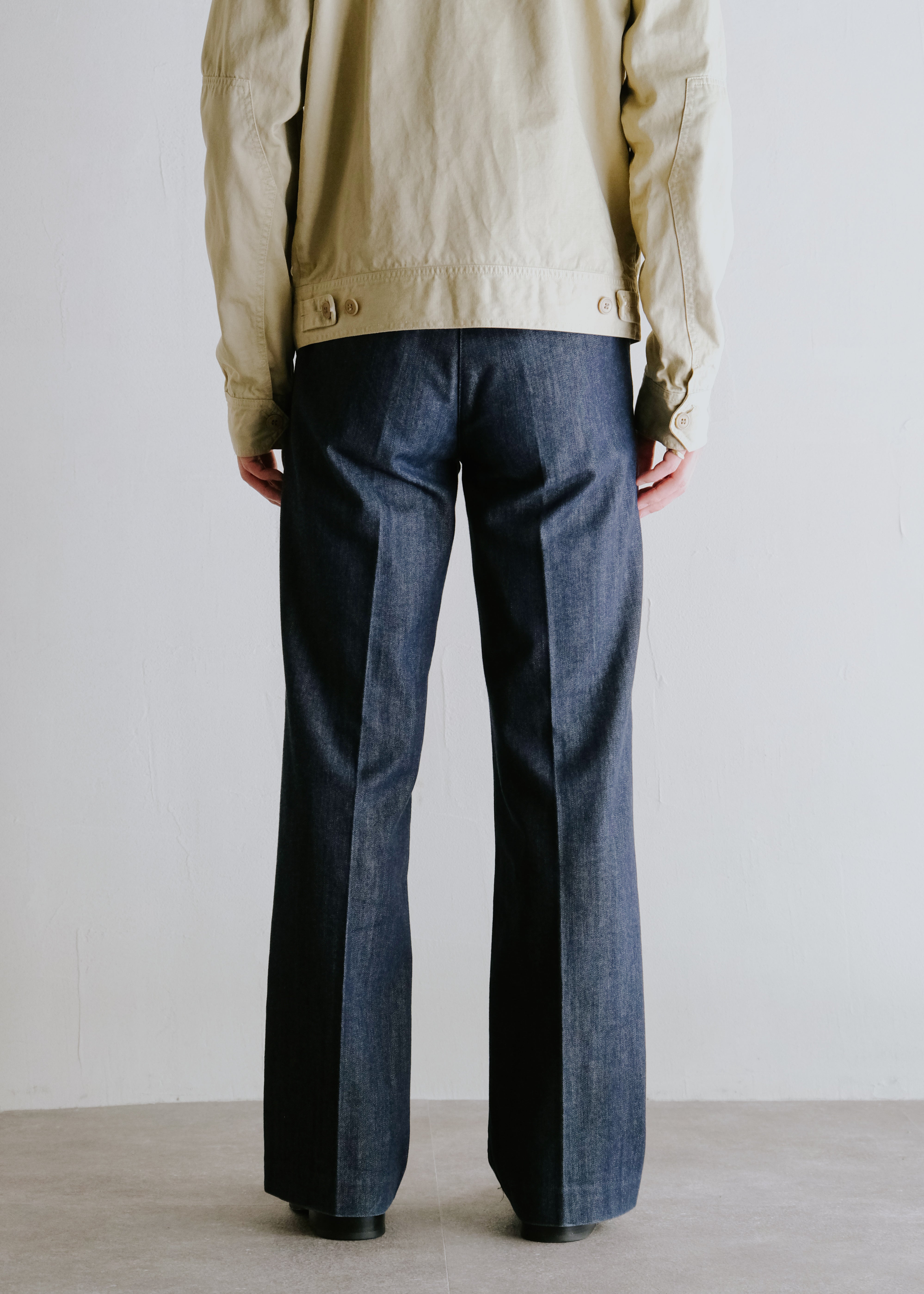 center creased boots cut denim trousers